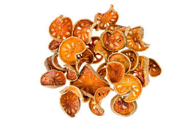 Pile of dried bael fruit isolated on white background