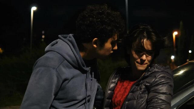 unrequited love - shy man tries to kiss his friend who rejects him - city night