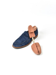 Wooden shoe lasts on a white background.