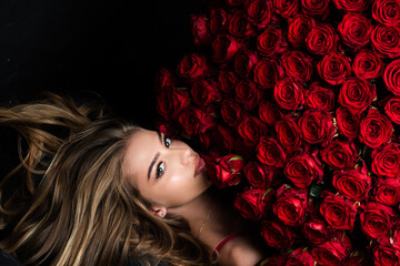 Roses for Valentines day. Flower bouquet. Sexy woman with rose bouquet. Holiday present.
