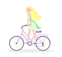 Fototapeta na wymiar A young girl in a green dress riding a bicycle on a white background. Happy blonde girl