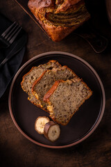 Slices of freshly baked banana bread on a ceramic plate
