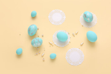 Composition with beautiful Easter eggs on color background