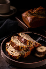 Slices of freshly baked banana bread on a ceramic plate