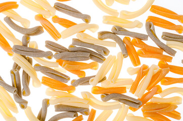 Pile of multi-colored pasta isolated on white background.