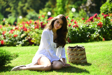 Spring young woman in summer fields. Happy girl outdoors in field. Woman enjoy outdoor recreation. Natural beauty. Spring time.