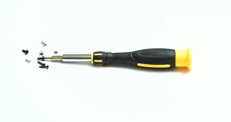 A screwdriver for the repair of small devices, watches, optics. Close-up.
