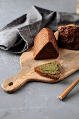Closeup on sliced triangle flourless diet grain bread on parchment paper