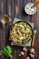 Linguine pasta with mushrooms, white cheese, spinach and garlic. Healthy eating. Vegetarian food. Diet.