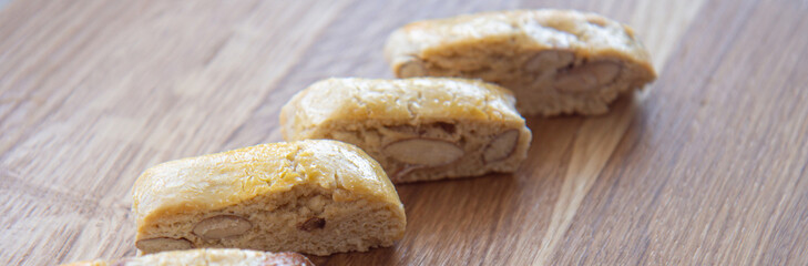 Sweet biscotti cookies with nuts on wooden background. Side vie