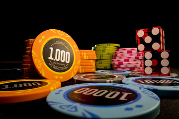 Gambling chips on a gaming table - 412097487