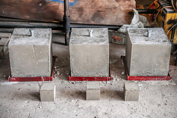 Concrete block cubes with steel bolts for concrete strength testing