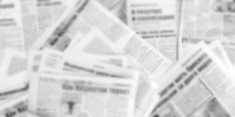 Abstract blurred image of old newspapers. Media news concept. Panoramic image. ..