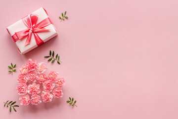 Valentines Day background with pink gift box and flowers