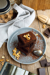 brownie pie with walnuts on a gray plate