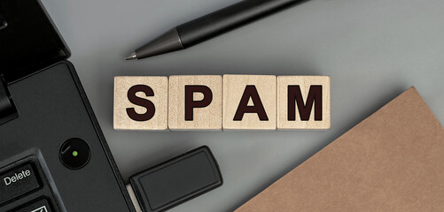 Spam - word concept from wooden blocks. Top view