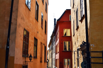 Fototapeta na wymiar Narrow street with colorful buildings in the Old Town (Gamla Stan), Stockholm center, Sweden