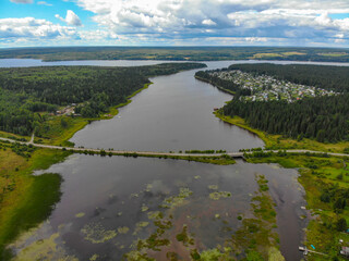 Aerial view of a small bridge over the river in Omutninsk (Kirov region, Russia)