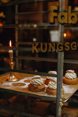 fresh semla bun near a burning candle