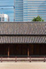 Close up view of an ancient japanese building and a modern building