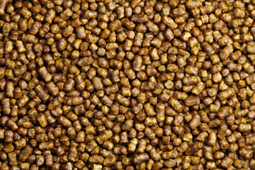 Buckwheat tea background close-up macro photography. Top view. Copy space. Scattered buckwheat tea pellets background.