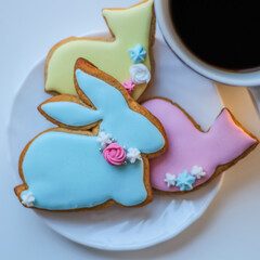 Easter bird and bunny festive sweet gingerbread cupcake, cookies. A cup of coffee and a delicious gingerbread is a wonderful dessert