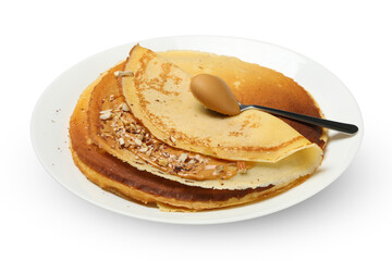 Plate of crepes with peanut butter and nuts isolated on white background