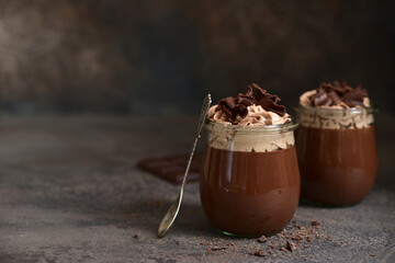 Delicious chocolate mousse or pudding with whipped cream.