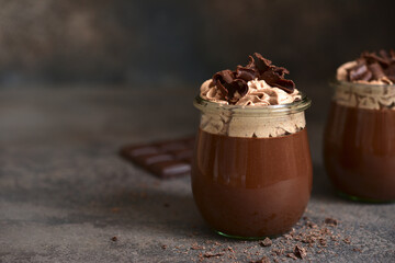 Delicious chocolate mousse or pudding with whipped cream.