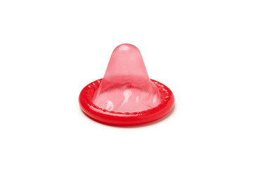 Single red condom isolated on white background