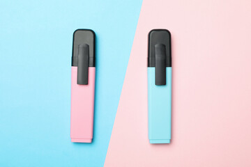 Pink and blue highlighters on two tone background