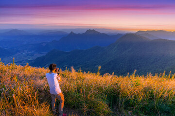 Naklejka na ściany i meble Beautiful mountains landscape. Sunset on Phu Chi Fa, North Thailand.
