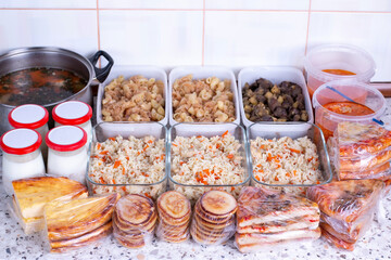 Prepared meal delivery concept. Assorted ready-to-eat dishes on the kitchen table