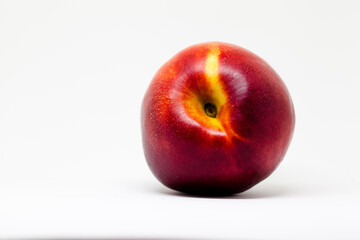 Fresh ripe nectarines, peach fruit, isolated in white