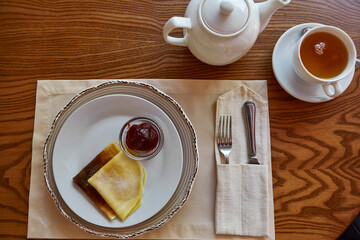 Pancakes With Honey And Tea. Tasting traditional Russian cuisine