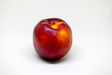 Fototapeta na wymiar Fresh ripe nectarines, peach fruit, isolated in white