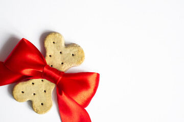 Dog   food biscuits  bone-shaped baked prize for the winner  With Red Bow .  Birthday , valentines...