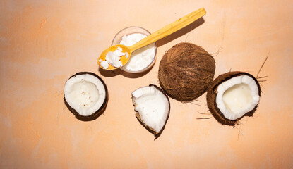 Fototapeta na wymiar Half of coconuts isolated on color background. Coconut cream. Top View. Flat lay.