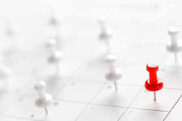Calendar page pinned in a calender on datebusiness meeting schedule, travel planning or project milestone and reminder concept.