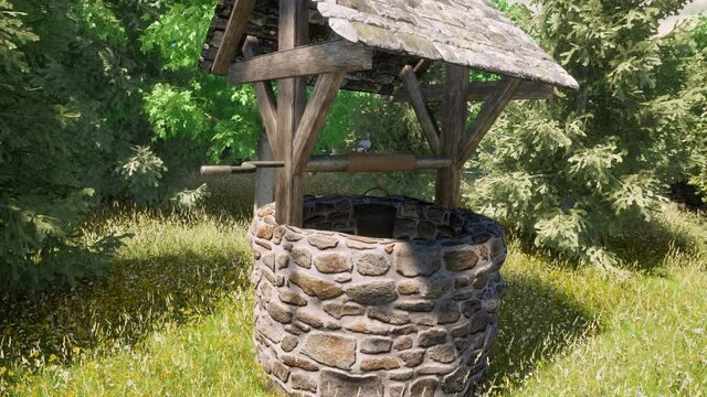 An old stone wishing well in the middle of a beautiful lush forest.