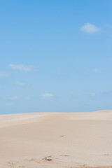 Fototapeta na wymiar Beautiful sand dunes at dusk against blue sky