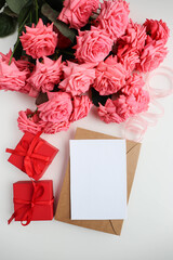 composition of a bouquet of roses and gift box 