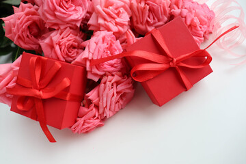 composition of a bouquet of roses and gift box 