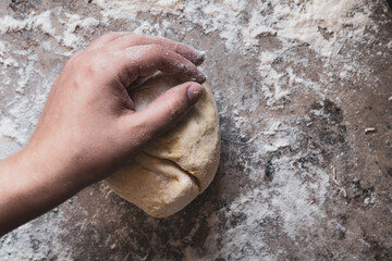 hands kneading homemade food, background with flour