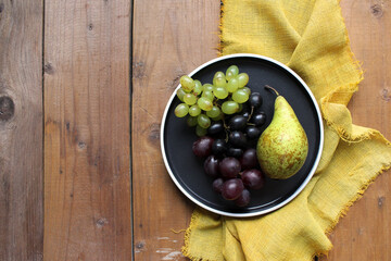 fruits. beautiful table setting. pear and grapes.