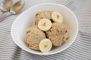 Homemade Peanut Butter Banana Ice Cream in a Bowl, side view. Close-up.