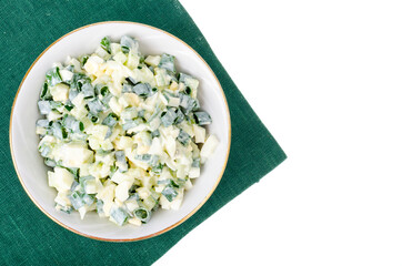 light diet salad with boiled egg, green onions and fresh cucumber