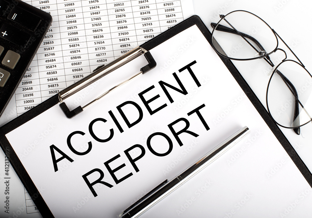 Aufkleber paper with text accident report on the table on the chart
