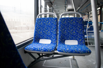 Empty bus interior. Blue seats without passengers. Public transport. Transportation of passengers...