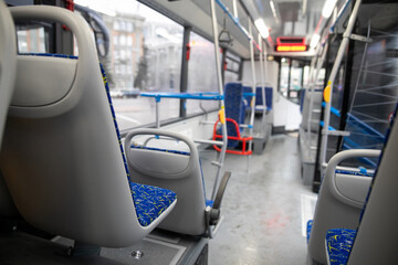 Empty bus interior. Blue seats without passengers. Public transport. Transportation of passengers...
